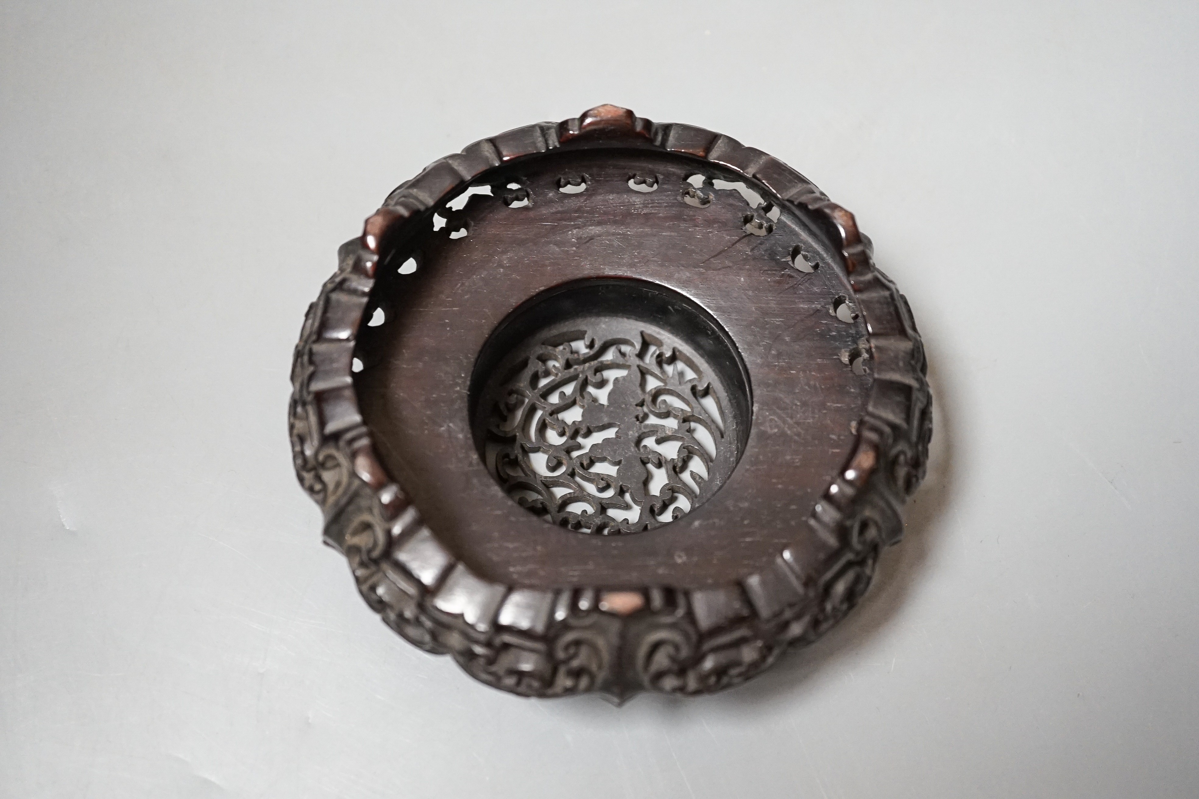 A fine 19th century Chinese hardwood stand, 11.4cm diameter